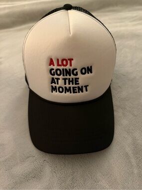 White & Black Trucker Hat with 'A LOT GOING ON AT THE MOMENT' Text